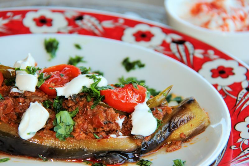 Stuffed Eggplant garnished with garlic yogurt and parsley